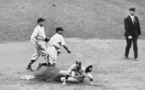 Washington Senators’ Buddy Myer turns a double play (Photo by Mark Rucker/Transcendental Graphics, Getty Images)