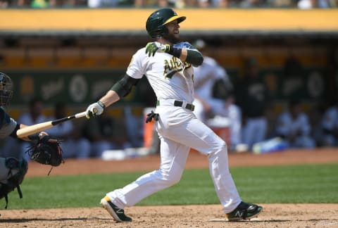 OAKLAND, CA – SEPTEMBER 02: Jed Lowrie #8 of the Oakland Athletics hits an rbi single scoring Marcus Semien #10 against the Seattle Mariners in the bottom of the six inning at Oakland Alameda Coliseum on September 2, 2018 in Oakland, California. (Photo by Thearon W. Henderson/Getty Images)