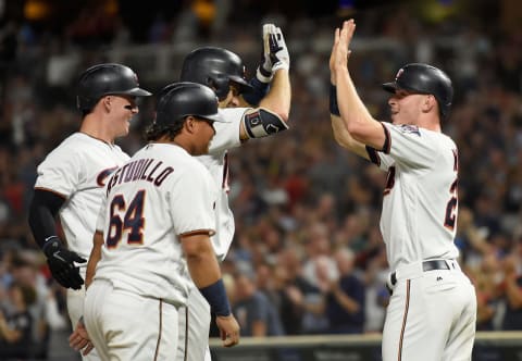 MINNEAPOLIS, MN – SEPTEMBER 11: (L-R) Tyler Austin #31, Willians Astudillo #64, Joe Mauer #7 and Max Kepler #26 of the Minnesota Twins celebrate a grand slam by Mauer against the New York Yankees during the fifth inning of the game on September 11, 2018 at Target Field in Minneapolis, Minnesota. (Photo by Hannah Foslien/Getty Images)