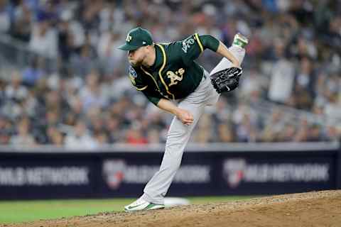 NEW YORK, NEW YORK – OCTOBER 03: Shawn Kelley #31 of the Oakland Athletics throws a pitch against the New York Yankees during the fifth inning in the American League Wild Card Game at Yankee Stadium on October 03, 2018 in the Bronx borough of New York City. (Photo by Elsa/Getty Images)