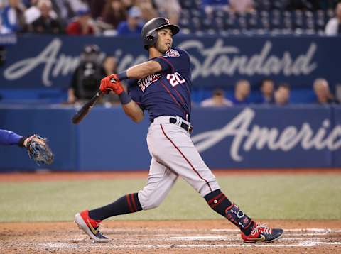 TORONTO, ON – MAY 06: Eddie Rosario #20 of the Minnesota Twins knocks in a run on a sacrifice fly in the ninth inning against the Toronto Blue Jays at Rogers Centre on May 6, 2019 in Toronto, Canada. (Photo by Tom Szczerbowski/Getty Images)