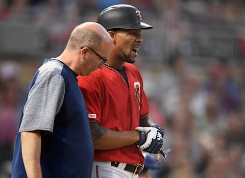 MINNEAPOLIS, MN – JUNE 14: Byron Buxton #25 of the Minnesota Twins reacts to being hit by a pitch as trainer Tony Leo checks on him during the sixth inning of the game against the Kansas City Royals on June 14, 2019 at Target Field in Minneapolis, Minnesota. The Twins defeated the Royals 2-0. (Photo by Hannah Foslien/Getty Images)