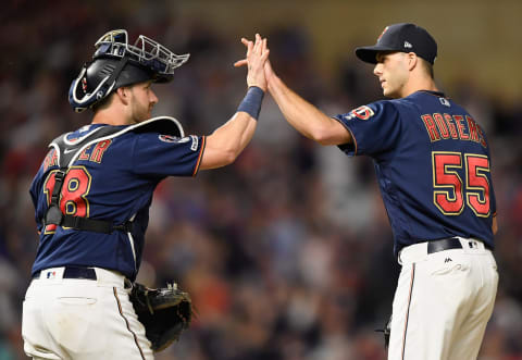 MINNEAPOLIS, MN – JUNE 15: Mitch Garver #18 and Taylor Rogers #55 of the Minnesota Twins celebrate defeating the Kansas City Royals after the game on June 15, 2019 at Target Field in Minneapolis, Minnesota. The Twins defeated the Royals 5-4. (Photo by Hannah Foslien/Getty Images)