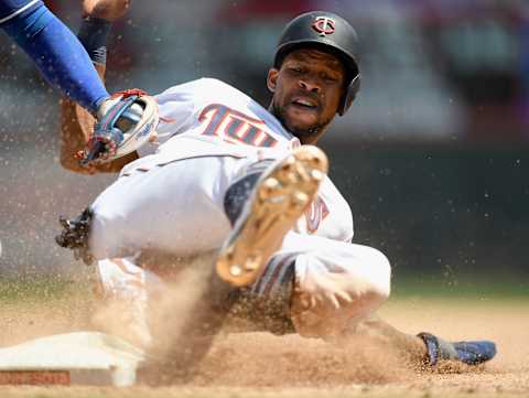 MINNEAPOLIS, MN – JULY 07: Asdrubal Cabrera #14 of the Texas Rangers tags out Byron Buxton #25 of the Minnesota Twins at third base to complete a double play during the fifth inning of the game on July 7, 2019 at Target Field in Minneapolis, Minnesota. The Rangers defeated the Twins 4-1 in eleven innings. (Photo by Hannah Foslien/Getty Images)