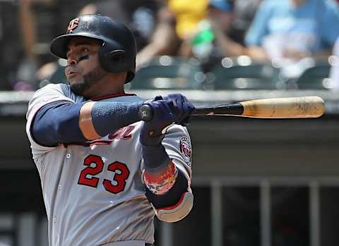 CHICAGO, ILLINOIS – JULY 28: Nelson Cruz #23 of the Minnesota Twinshits a single in the 1st inning against the Chicago White Sox at Guaranteed Rate Field on July 28, 2019 in Chicago, Illinois. (Photo by Jonathan Daniel/Getty Images)