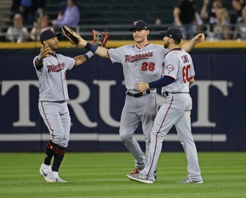 CHICAGO, ILLINOIS – AUGUST 27: (L-R) Eddie Rosario #20, Maxx Kepler #26 and Jake Cave #60 of the Minnesota Twins celebrate a win against the Chicago White Sox at Guaranteed Rate Field on August 27, 2019 in Chicago, Illinois. The Twins defeated the White Sox 3-1. (Photo by Jonathan Daniel/Getty Images)