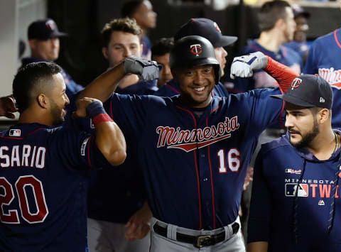 CHICAGO, ILLINOIS – AUGUST 28: Jonathan Schoop #16 of the Minnesota Twins celebrates in the dugout with teammates after his home run in the eighth inning against the Chicago White Sox at Guaranteed Rate Field on August 28, 2019 in Chicago, Illinois. (Photo by Quinn Harris/Getty Images)