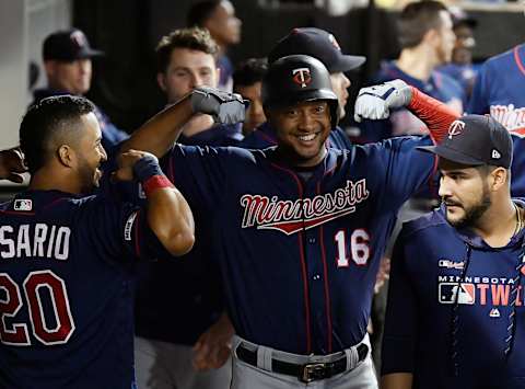 CHICAGO, ILLINOIS – AUGUST 28: Jonathan Schoop #16 of the Minnesota Twins celebrates in the dugout with teammates after his home run in the eighth inning against the Chicago White Sox at Guaranteed Rate Field on August 28, 2019 in Chicago, Illinois. (Photo by Quinn Harris/Getty Images)