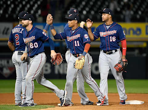 CHICAGO, ILLINOIS – AUGUST 28: Jake Cave #60, Jorge Polanco #11, and Jonathan Schoop #16 of the Minnesota Twins celebrate the 8-2 victory against the Chicago White Sox at Guaranteed Rate Field on August 28, 2019 in Chicago, Illinois. (Photo by Quinn Harris/Getty Images)