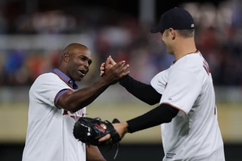 Former Minnesota Twins Joe Mauer and Torii Hunter greet each other prior to game three of the American League Division Series. (Photo by Elsa/Getty Images)