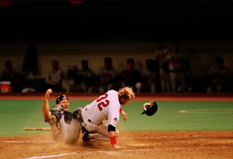 Dan Gladden of the Minnesota Twins collides with Atlanta Braves catcher Greg Olsen during Game One of 1991 World Series. (Photo by Ron Vesely/MLB Photos via Getty Images)