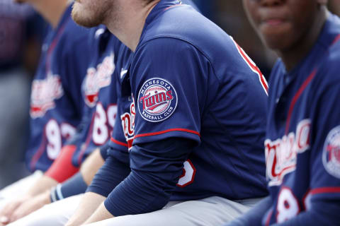 Detail view of the Minnesota Twins logo as players sit in the dugout during a Grapefruit League spring training game. (Photo by Joe Robbins/Getty Images)