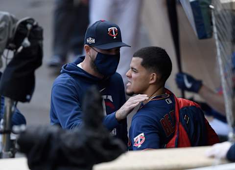 Manager Rocco Baldelli of the Minnesota Twins speaks to starting pitcher Jose Berrios in the dugout during the fifth inning of Game Two. (Photo by Hannah Foslien/Getty Images)