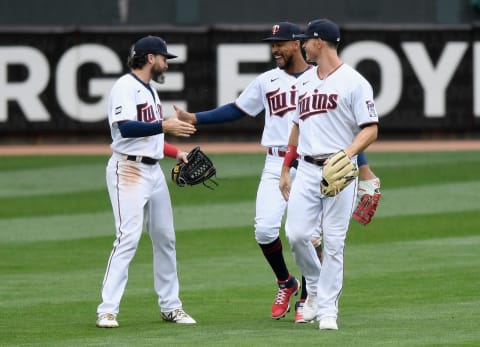 Jake Cave, Byron Buxton, and Max Kepler, of the Minnesota Twins celebrate defeating the Kansas City Royals. (Photo by Hannah Foslien/Getty Images)