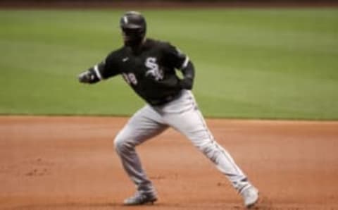 Luis Robert of the Chicago White Sox leads off first base in the first inning against the Milwaukee Brewers. (Photo by Dylan Buell/Getty Images)