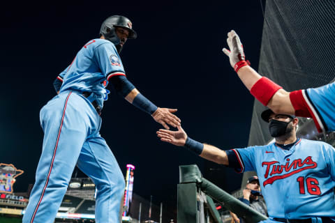 Marwin Gonzalez of the Minnesota Twins celebrates with teammates after scoring a run against the Detroit Tigers. (Photo by Brace Hemmelgarn/Minnesota Twins/Getty Images)