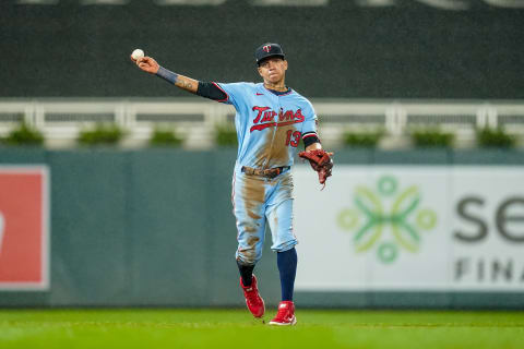 Ehire Adrianza of the Minnesota Twins throws against the Cincinnati Reds. (Photo by Brace Hemmelgarn/Minnesota Twins/Getty Images)