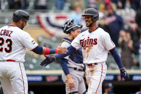 Byron Buxton of the Minnesota Twins celebrates with Nelson Cruz after hitting a home run. (Photo by Brace Hemmelgarn/Minnesota Twins/Getty Images)