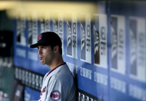 KANSAS CITY, MO – JUNE 4: Joe Mauer #7 of the Minnesota Twins watches from the dugout during a game against the Kansas City Royals in the first inning at Kauffman Stadium June 4, 2012 in Kansas City, Missouri. (Photo by Ed Zurga/Getty Images)