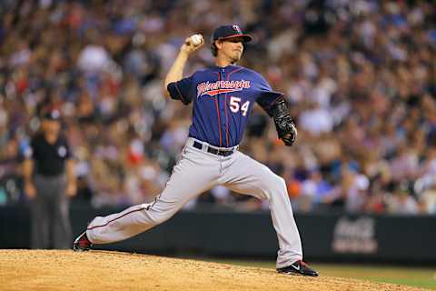 Matt Guerrier of the Minnesota Twins pitches against the Colorado Rockies. (Photo by Justin Edmonds/Getty Images)