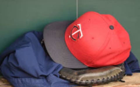 BALTIMORE, MD – AUGUST 20: A Minnesota Twins cap and glove in the dug out before a baseball game against the Baltimore Orioles at Oriole Park at Camden Yards at on August 20, 2015 in Baltimore, Maryland. (Photo by Mitchell Layton/Getty Images)