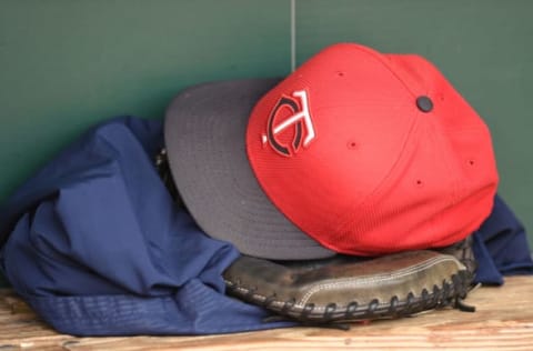 BALTIMORE, MD – AUGUST 20: A Minnesota Twins cap and glove in the dug out before a baseball game against the Baltimore Orioles at Oriole Park at Camden Yards at on August 20, 2015 in Baltimore, Maryland. (Photo by Mitchell Layton/Getty Images)