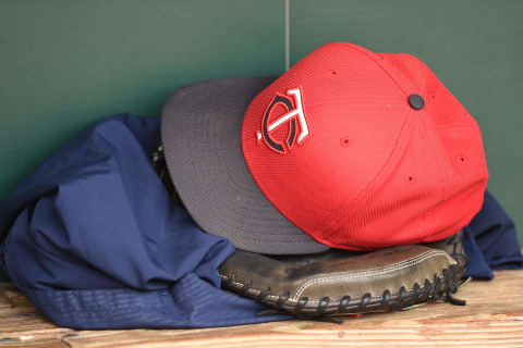 BALTIMORE, MD – AUGUST 20: A Minnesota Twins cap and glove in the dug out before a baseball game against the Baltimore Orioles at Oriole Park at Camden Yards at on August 20, 2015 in Baltimore, Maryland. (Photo by Mitchell Layton/Getty Images)