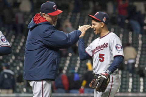 CLEVELAND, OH – MAY 5: Hitting coach Tom Brunansky #23 of the Minnesota Twins celebrates with Eduardo Escobar #5 after the Twins defeated the Cleveland Indians at Progressive Field on May 5, 2014 in Cleveland, Ohio. The Twins defeated the Indians 1-0 in 10 innings. (Photo by Jason Miller/Getty Images)