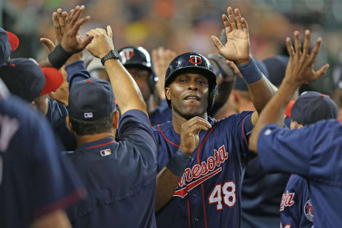 Torii Hunter of the Minnesota Twins celebrates with his teammates in the dugout after scoring. (Photo by Leon Halip/Getty Images)