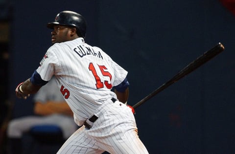 Cristian Guzman of the Minnesota Twins follows through after hitting the ball against the New York Yankees during game three of the American League Divisional Series on October 8, 2004 at the Hubert H. Humphrey Metrodome in Minneapolis, Minnesota. (Photo by Jonathan Daniel/Getty Images)