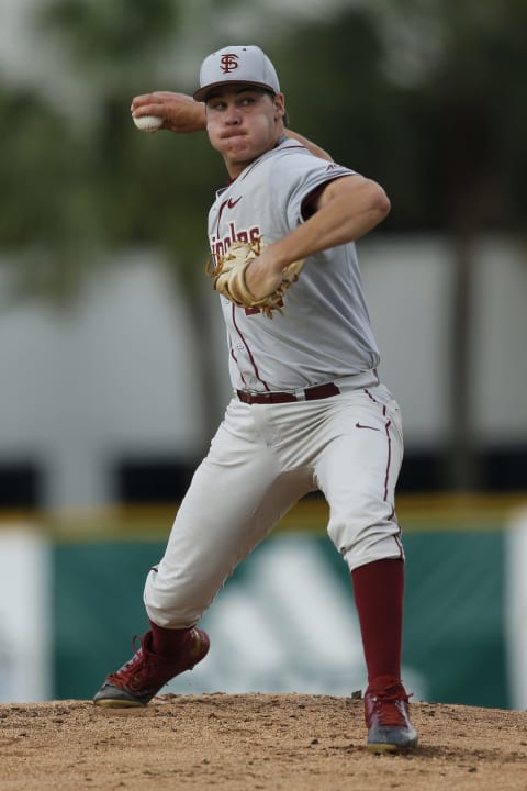 Cole Sands of the Florida State Seminoles throws the ball against the Miami Hurricanes during first inning action on April 21, 2017 at Alex Rodriguez Park at Mark Light Field in Coral Gables, Florida. (Photo by Joel Auerbach/Getty Images)