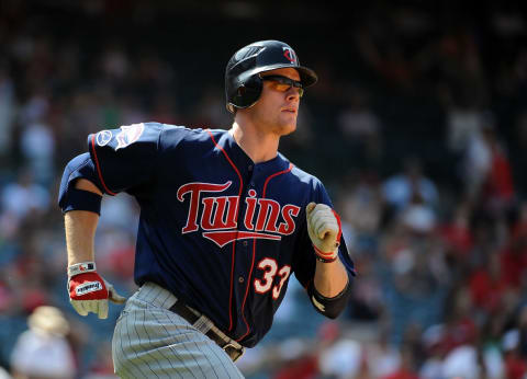 Justin Morneau of the Minnesota Twins runs to first against the Los Angeles Angels on July 26, 2009. (Photo by Harry How/Getty Images)