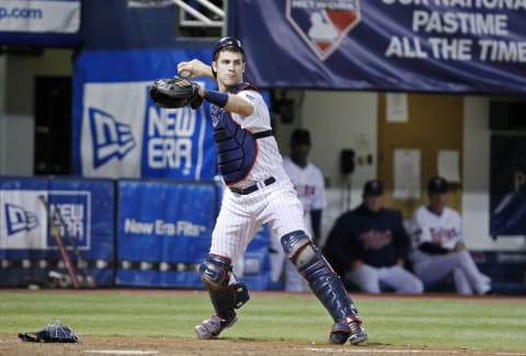 Joe Mauer of the Minnesota Twins throws to first against the New York Yankees. (Photo by Bruce Kluckhohn/Getty Images)