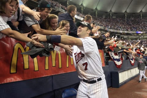 MINNEAPOLIS – OCTOBER 06: Joe Mauer #7 of the Minnesota Twins celebrates with fans after winning the American League tiebreaker game against the Detroit Tigers on October 6, 2009 at Hubert H. Humphrey Metrodome in Minneapolis, Minnesota. (Photo by Jamie Squire/Getty Images)