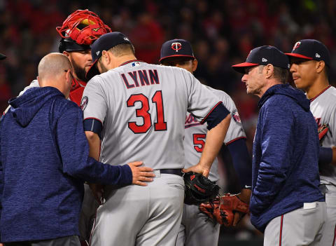 ANAHEIM, CA – MAY 11: Manager Paul Molitor #4 of the Minnesota Twins looks on as starting pitcher Lance Lynn #31 is checked by medical staff during the third inning of the game against the Los Angeles Angels of Anaheim at Angel Stadium on May 11, 2018 in Anaheim, California. (Photo by Jayne Kamin-Oncea/Getty Images)