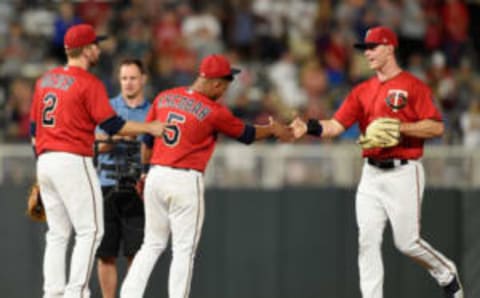 MINNEAPOLIS, MN – JUNE 01: (L-R) Brian Dozier #2, Eduardo Escobar #5 and Max Kepler #26 of the Minnesota Twins celebrate defeating the Cleveland Indians 7-4 after the game on June 1, 2018 at Target Field in Minneapolis, Minnesota. (Photo by Hannah Foslien/Getty Images)