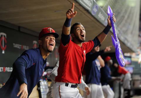 MINNEAPOLIS, MN – JUNE 08: Jose Berrios #17 and Eddie Rosario #20 of the Minnesota Twins celebrate a solo home run by teammate Robbie Grossman #36 against the Los Angeles Angels of Anaheim during the sixth inning of the game on June 8, 2018 at Target Field in Minneapolis, Minnesota. Rosario was holding an inflatable Prince guitar as the team honored the late musician. The Angels defeated the Twins 4-2. (Photo by Hannah Foslien/Getty Images)