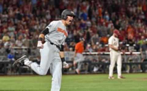 Omaha, NE – JUNE 27: Outfielder Trevor Larnach #11 of the Oregon State Beavers reacts after hitting a two run home run to give the Beavers a 5-3 lead in the ninth inning against the Arkansas Razorbacks during game two of the College World Series Championship Series on June 27, 2018 at TD Ameritrade Park in Omaha, Nebraska. (Photo by Peter Aiken/Getty Images)