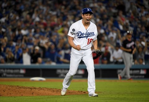 Kenta Maeda of the Los Angeles Dodgers reacts after striking out Yan Gomes of the Washington Nationals. (Photo by Harry How/Getty Images)