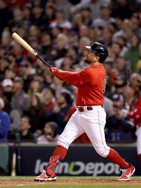 Kyle Schwarber of the Boston Red Sox watches his home run against the Houston Astros during Game Three of the American League Championship Series. (Photo by Elsa/Getty Images)