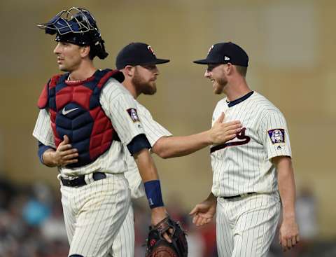 MINNEAPOLIS, MN – AUGUST 19: (L-R) Jason Castro #21, Chris Gimenez #38 and Mitch Garver #43 of the Minnesota Twins celebrate winning against the Arizona Diamondbacks after the game on August 19, 2017 at Target Field in Minneapolis, Minnesota. It was Garver’s Major League debut. The Twins defeated the Diamondbacks 5-0. (Photo by Hannah Foslien/Getty Images)