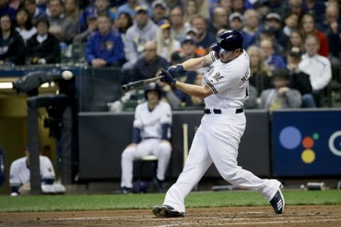 MILWAUKEE, WI – OCTOBER 20: Mike Moustakas #18 of the Milwaukee Brewers hits a single against the Los Angeles Dodgers during the second inning in Game Seven of the National League Championship Series at Miller Park on October 20, 2018 in Milwaukee, Wisconsin. (Photo by Jonathan Daniel/Getty Images)