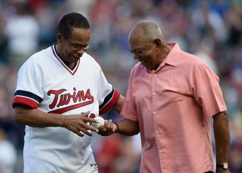 MINNEAPOLIS, MN – JULY 03: Hall of Fame player Rod Carew is handed the ball from his ceremonial pitch by former teammate Tony Oliva as Carew is honored before the game between the Minnesota Twins and the Los Angeles Angels of Anaheim on July 3, 2017 at Target Field in Minneapolis, Minnesota. (Photo by Hannah Foslien/Getty Images)