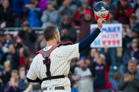 Minnesota Twins catcher Joe Mauer acknowledges the fans in the ninth inning of his final MLB game. (Brad Rempel-USA TODAY Sports)