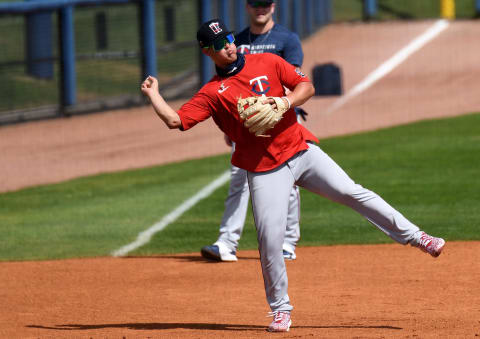 Minnesota Twins infielder Jose Miranda warms up before the start of the game against the Tampa Bay Rays during spring training at Charlotte Sports Park. Mandatory Credit: Jonathan Dyer-USA TODAY Sports