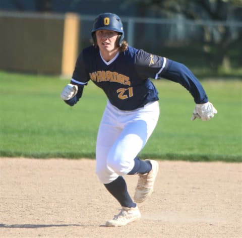 Ozaukee senior Noah Miller takes off on a base hit during a game on May 18, 2021.