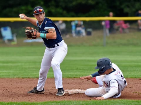 Drew Bowser of Y-D breaks up a double play attempt by Brewster shortstop Zach Neto.