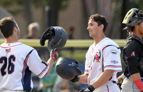 Brooks Lee is greeted by teammate Kody Huff after hitting a two run homer during the Cape Cod League game against Chatham.