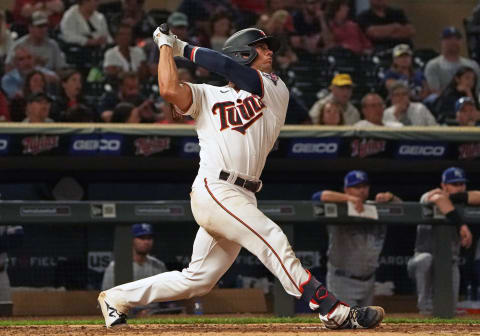 Minnesota Twins catcher Ben Rortvedt hits an RBI-single against the Kansas City Royals. (Nick Wosika-USA TODAY Sports)