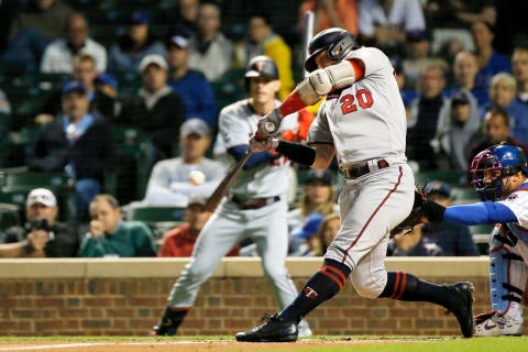 Minnesota Twins third baseman Josh Donaldson hits a sacrifice fly against the Chicago Cubs during the first inning at Wrigley Field. (Jon Durr-USA TODAY Sports)